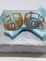 Pack X 1 anillo de letra “SADIOR” de color dorado y plateado